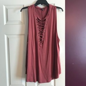 Rust color tank. Deep lace up v-neck .